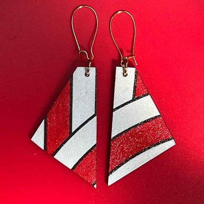 candy cane earrings on red by madera design studio