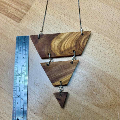 Image showing that the layered triangle necklace is 3 1/2 inches long