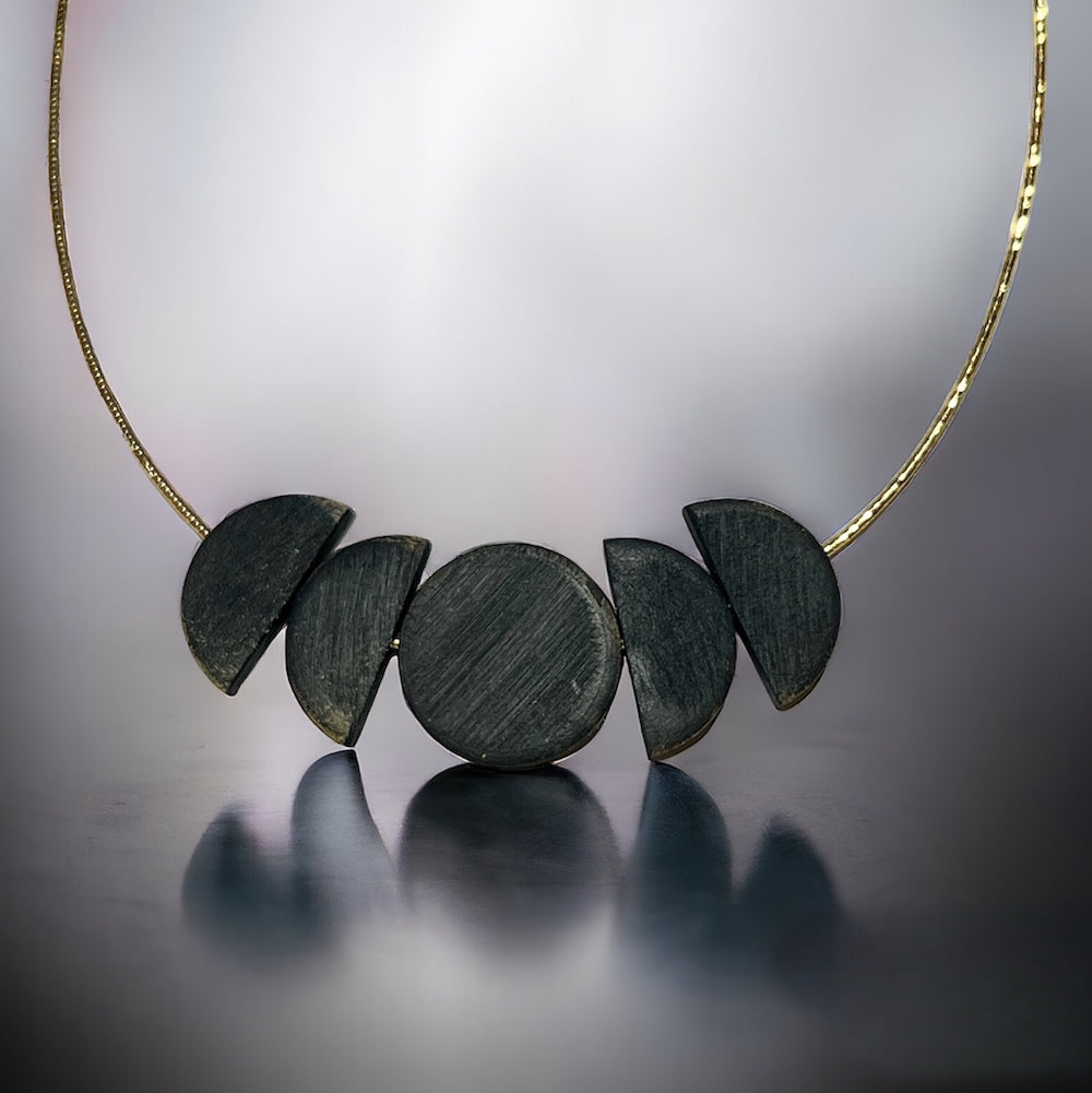 Black Moon wooden necklace on gold chain by Madera Design studio