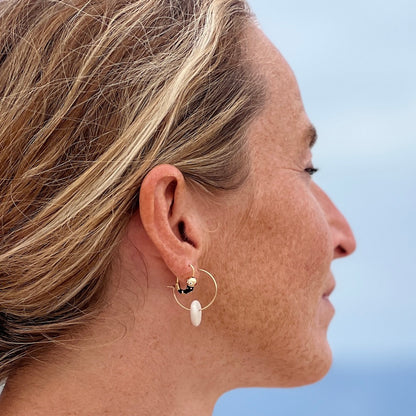 Round, circle, stone earrings on model at beach - upcycled by Justinart